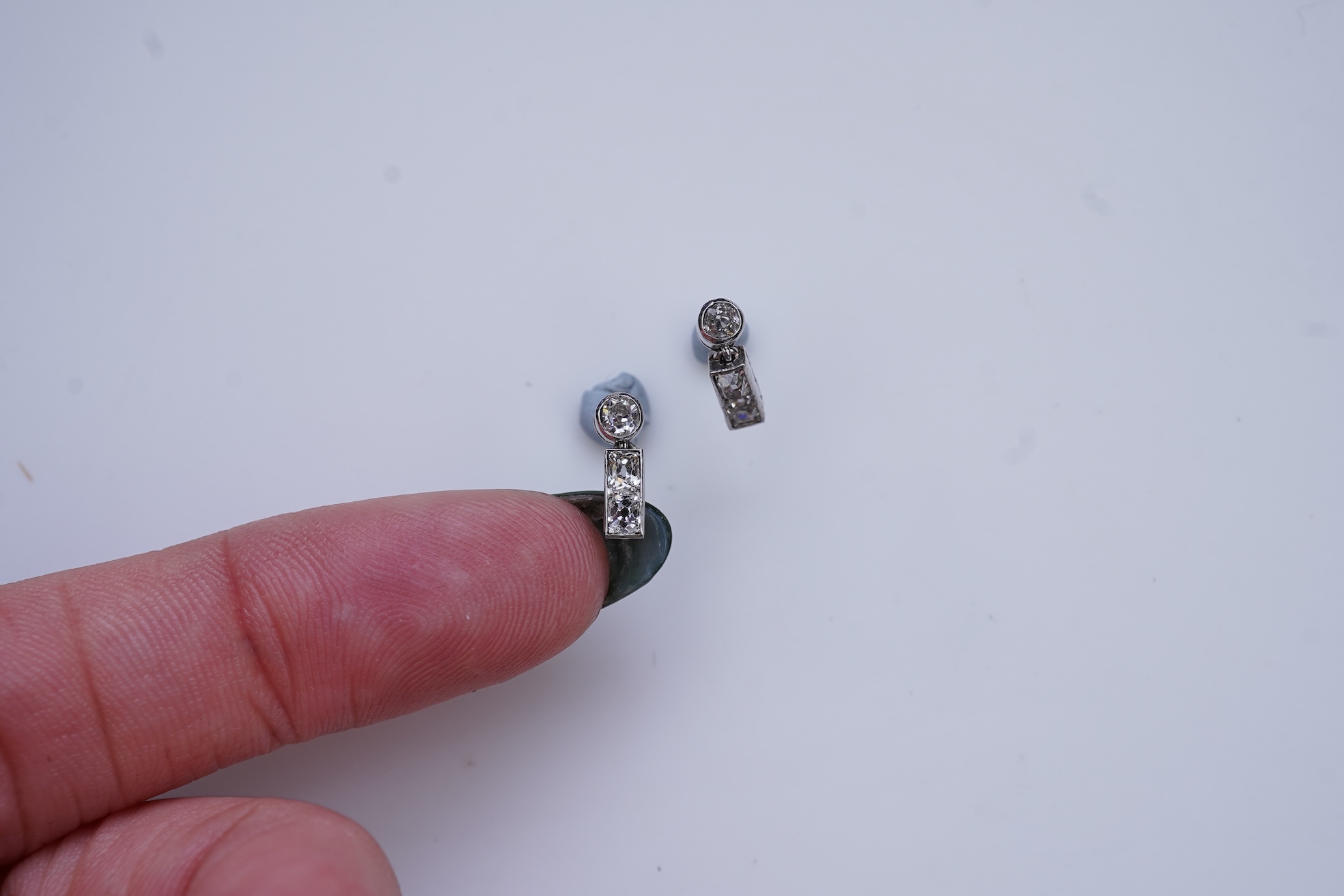 A pair of diamond earrings, early 20th century composite
